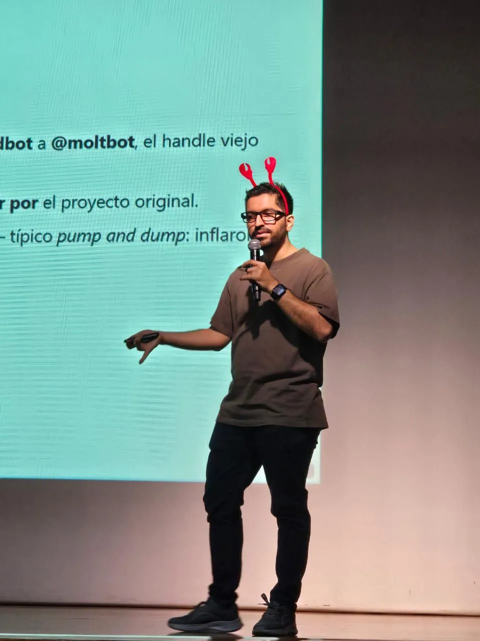 Sergio presenting the rebrand slide explaining the handle change from @clawdbot to @moltbot and the pump-and-dump scam