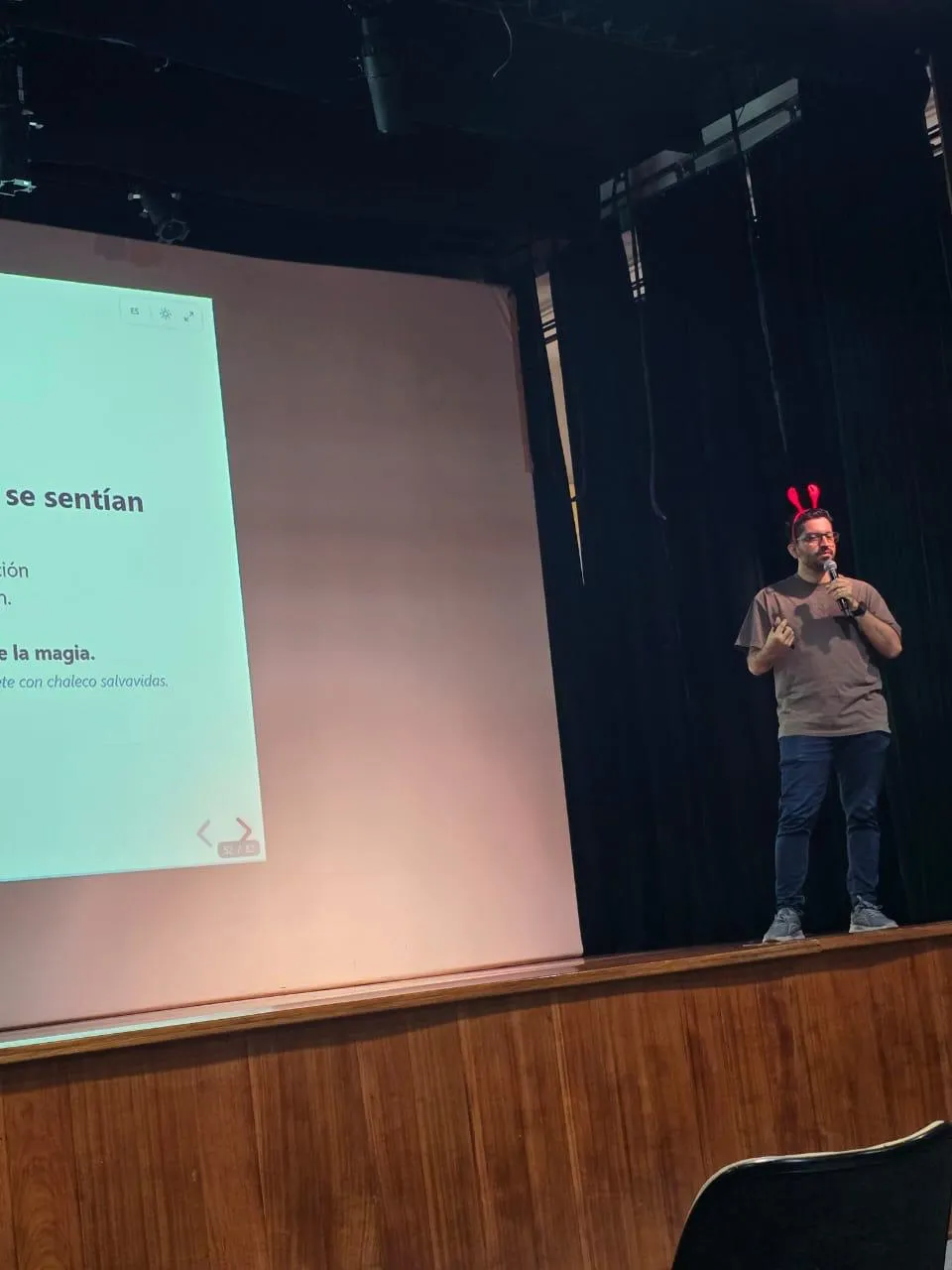 Wide shot of Sergio on stage presenting the slide about how OpenClaw's early days felt wild