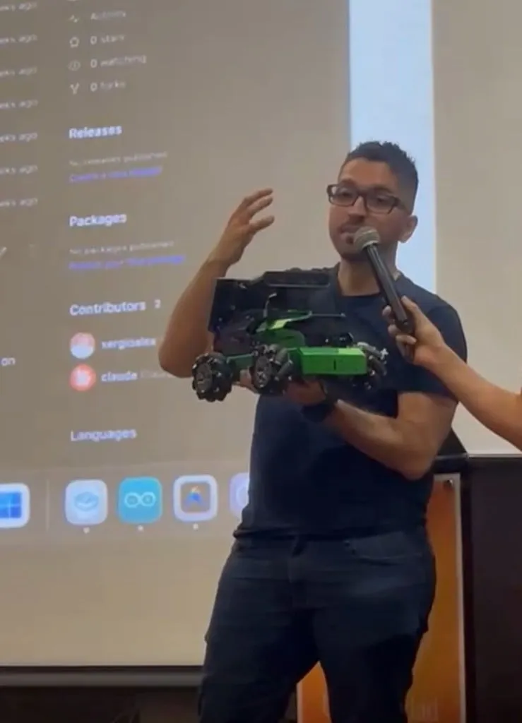 Sergio demonstrating robotics with mecanum wheel robot